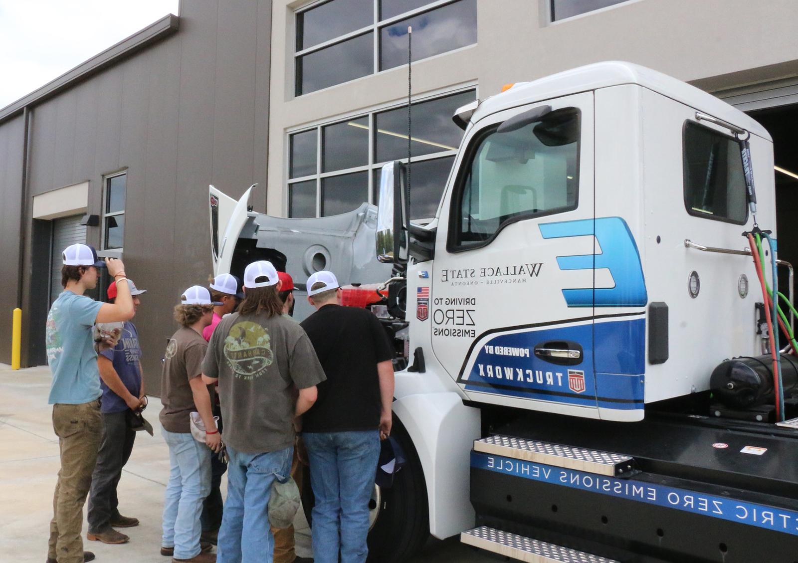 Students inspect truck